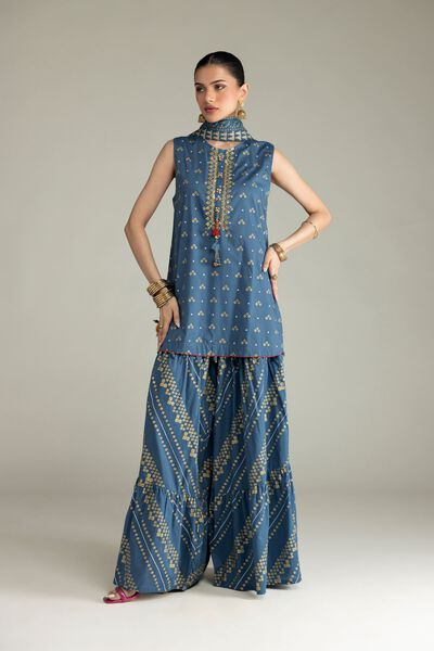 strapless open back dress Khadi cotton burgundy blue pocket dressFloral placement embroidery at  shoulders and pocketsGathers at pocket outlinesContrast tape detailing at  inner neck and sleeve Length:- 36 inches main image 1